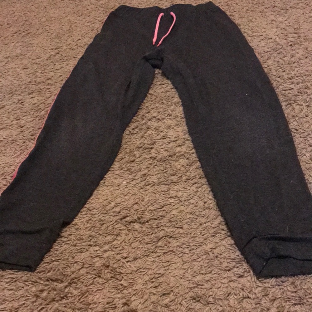Joggers or sweat pants with a pink sequence